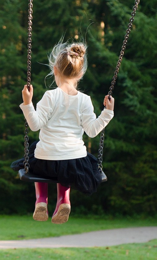 Girl on park swing